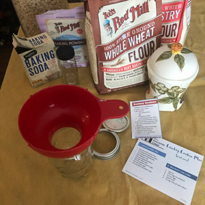 mis en place for assembling cookie mix in a jar