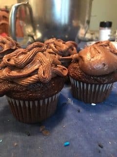 chocolate frosting on cupcakes