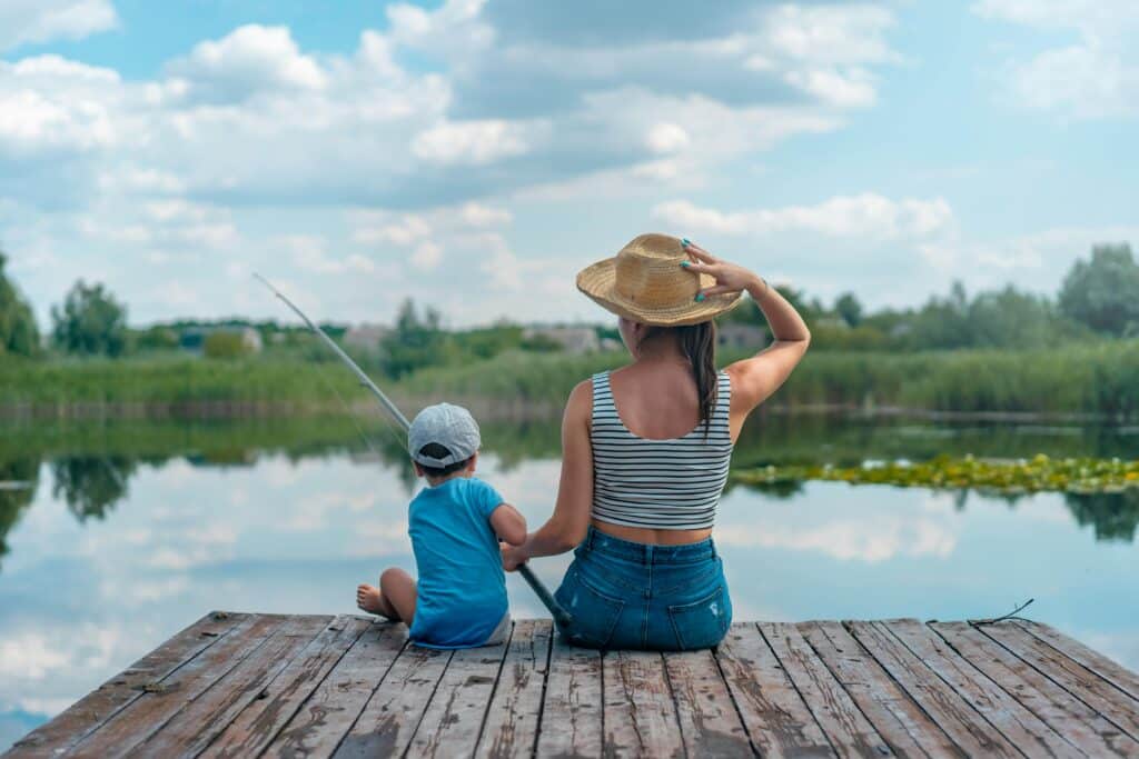kid and mom fishing off deck