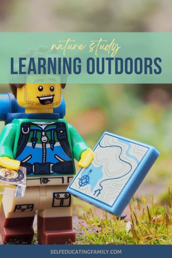 lego guy hiking with trail map
