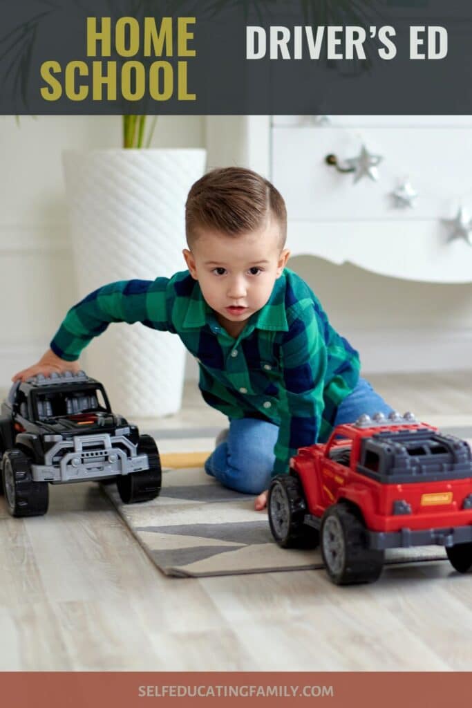 kid playing with toy monster trucks