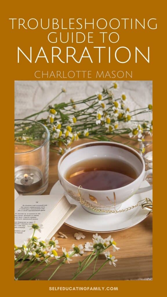 book with teacup, chamomile flowers, and candle