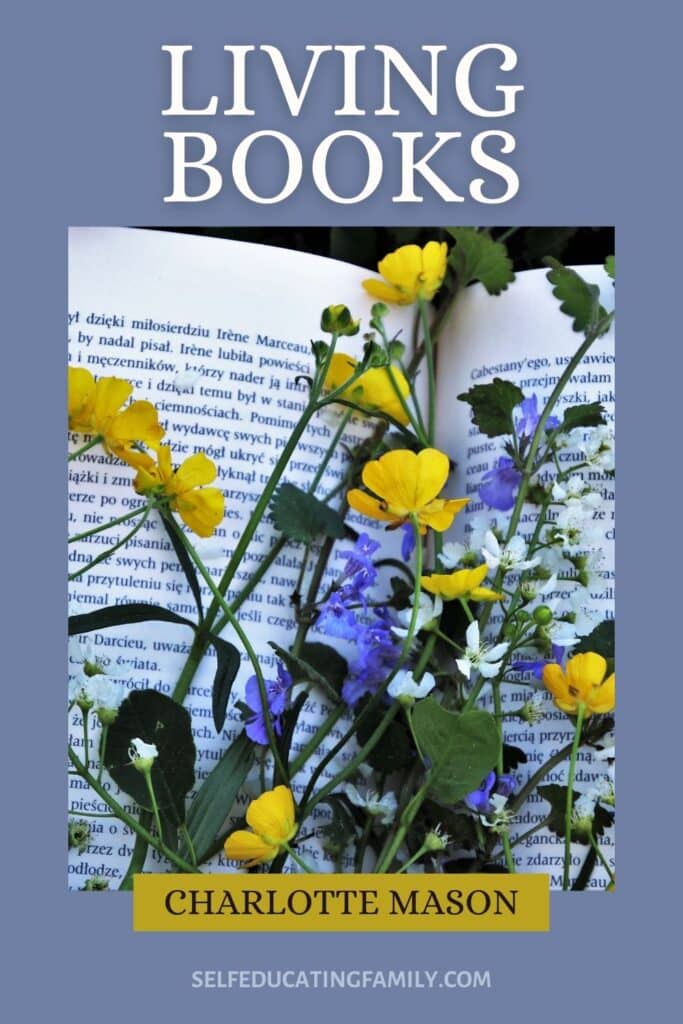 open book with yellow, blue, and white flowers laying on top of it