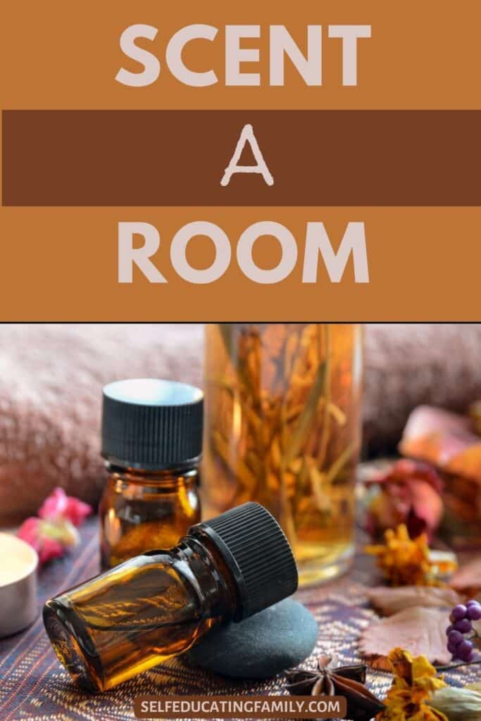 essential oil jar leaning on a rock with dried flowers and other jars near it
