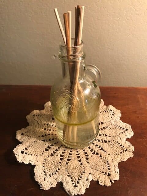 reed diffuser on handmade doily