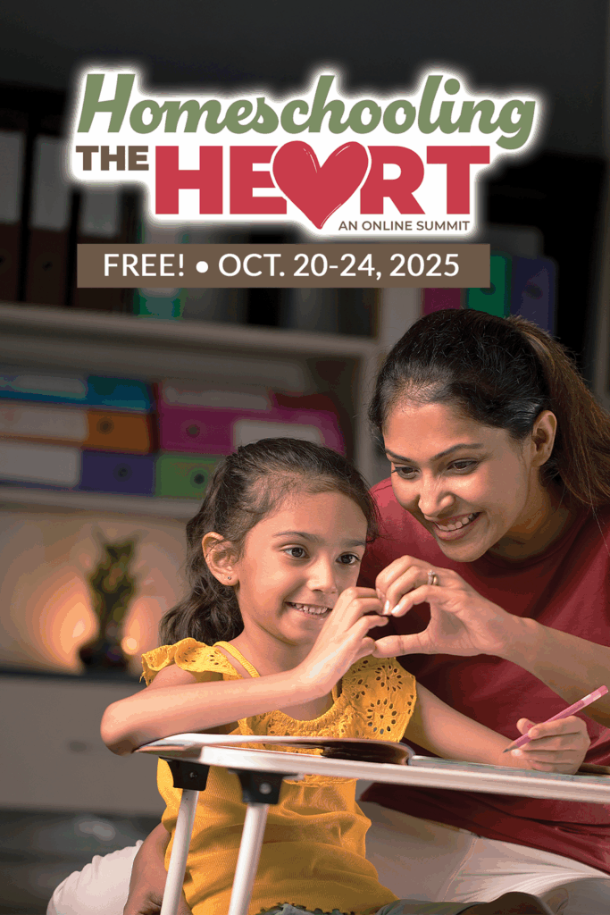 child and mom making a heart with their fingers together sitting at desk and smiling