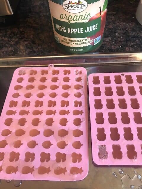 silicone molds of gummies filled with apple juice