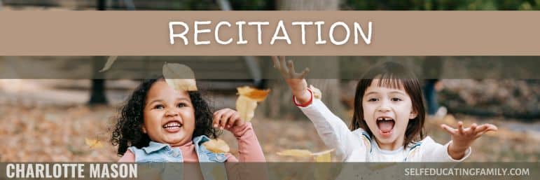 two little girls catching autumn leaves and smiling, laughing