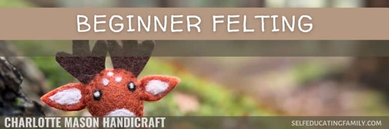 felted deer poking head out of greenery